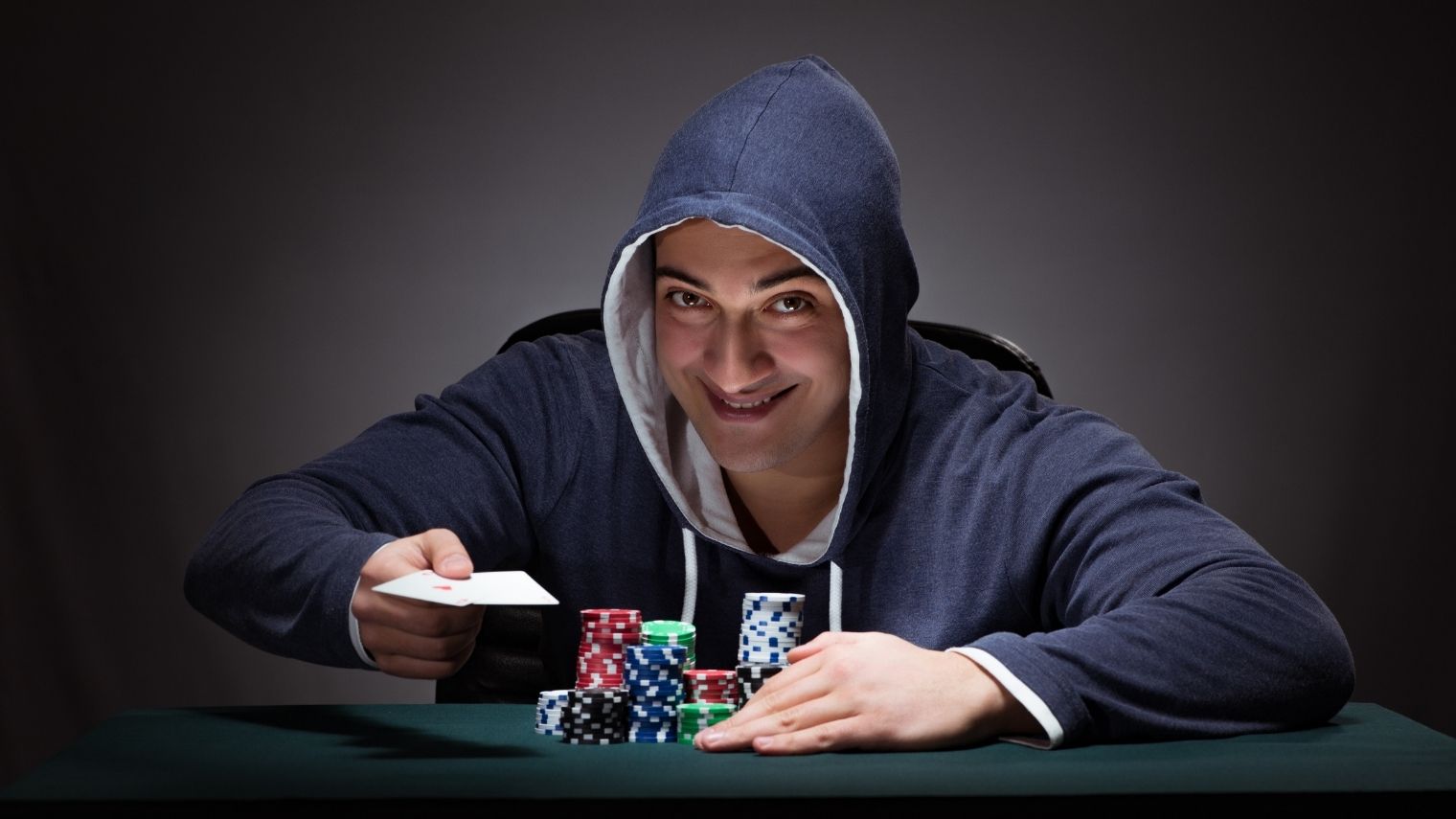 Poker player bluffing with cards and chips.