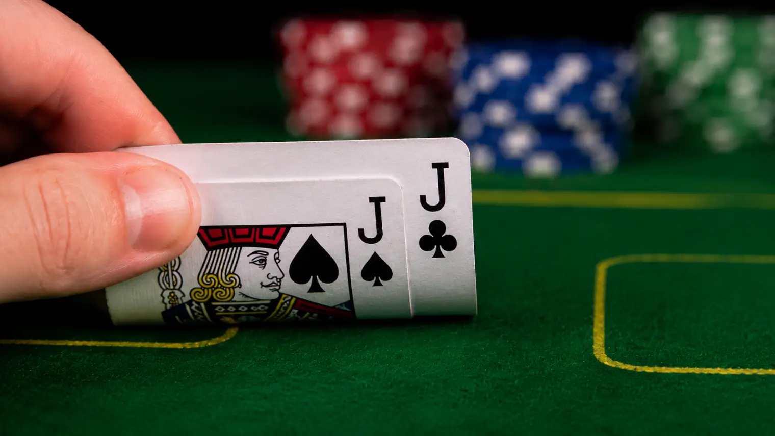 Poker player holding pocket jacks preflop while facing a raise.